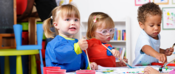 Three children painting